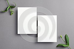 Blank invitation card mockup with front and back sides and botanical decorations