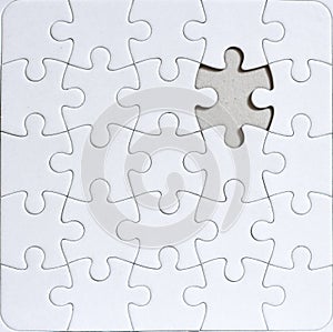 Blank jigsaw puzzle with missing puzzle piece photo