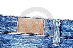 Blank leather jeans label sewed on jeans.