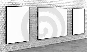 Blank light boxes on white brick wall
