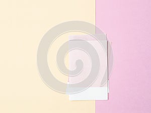 The blank light pink color paper note on beautiful background
