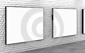 Blank lightboxes on white brick wall