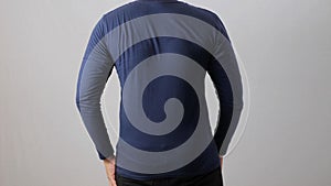 Blank long sleeved shirt mock up template, back rear view, Asian man wear plain dark navy blue t-shirt isolated on white. Tee