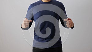 Blank long sleeved shirt mock up template, front view, Asian man wear plain dark navy blue t-shirt isolated on white. Tee design