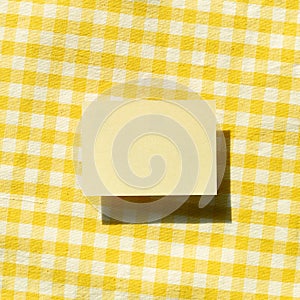 Blank memo pad, empty paper on fabric background