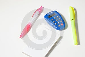 Blank memopad, pen and bank token key on white background with negative space photo