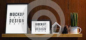 Blank mockup frame on wall shelf. Mock up blank white picture frame on wooden shelf in the living room