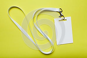 Blank name tag with lanyard. Mockup name tag is blank for your text on yellow background