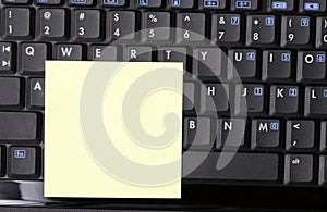 Blank Note On Black Laptop