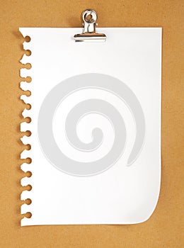 Blank note paper on cardboard background