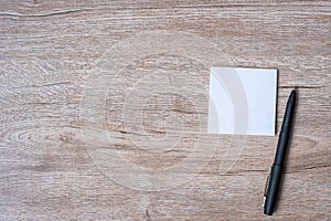 Blank note with pen and on wooden table background. Strategy, mission, vision and Goal concept