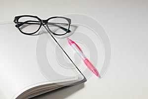 Blank notebook on white background with negative space