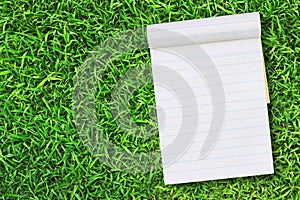 Blank notebook on Green Grass