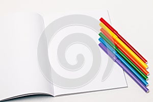 Markers form the LGBT insignia on white paper photo