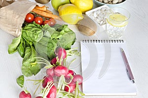 Blank notebook and lot of vegetables, fruits. Concept of healthy lifestyle, meal planning and good purchase