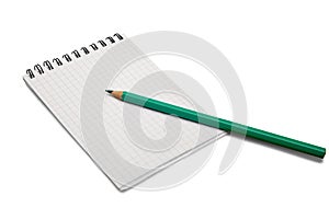 Blank notebook and pencil on a white background