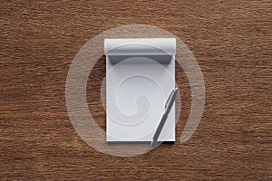 Blank notebook with pen