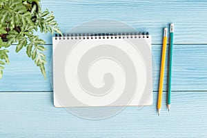 Blank notebook with and pencil on blue background,Flat lay photo of notebook for your message