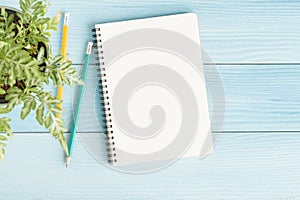 Blank notebook with and pencil on blue background,Flat lay photo of notebook for your message