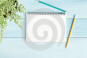 Blank notebook with and pencil on blue background,Flat lay photo of notebook for your message