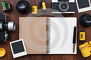 Blank notebook with photo film, photo frames and camera