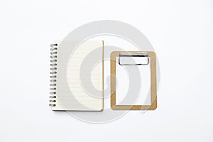 Blank notebook and small wooden paper clipboard isolate on white background