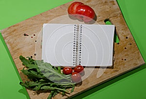 Blank notebook spiraled for recording recipes, notes, a place for advertising