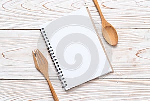 blank notebook for text note on wooden surface with copy sapce