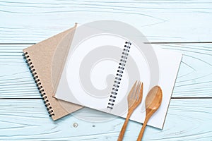 blank notebook for text note on wooden surface with copy sapce