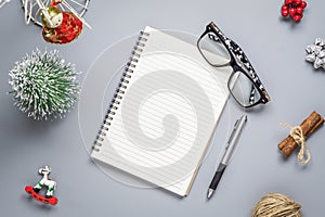 Blank notebook on  wood background with Christmas ornaments decorations. Mockup Christmas background with notebook for wish list