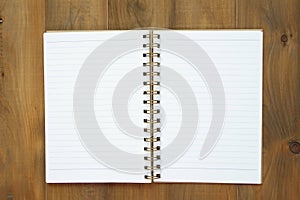 Blank notebook on wooden table