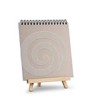 Blank notebook on wooden tripod standing isolated on white background
