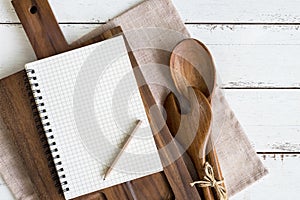 Blank notebook with wooden utensil