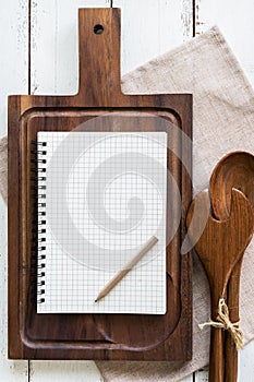 Blank notebook with wooden utensil