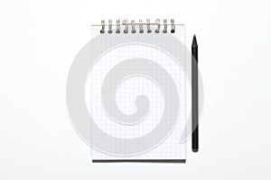 Blank notepad and black pencil isolated on white background with copy space for your text