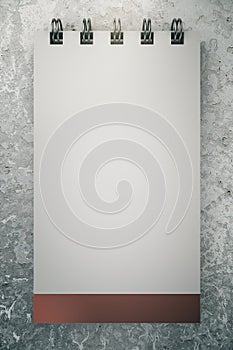Blank notepad closeup on concrete background