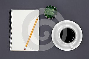 Blank notepad and coffee cup, conceptual minimalism.