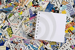 Blank Notepad on Magazine Clipping Background