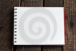 Blank notepad and on office wooden table