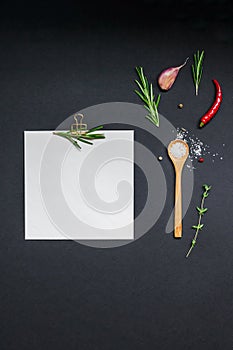 Blank notepad pages with greens herbs and spices