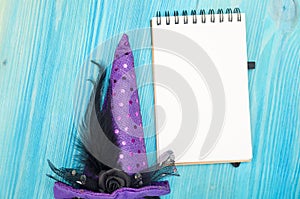 Blank notepad paper page and witch fancy hat. To do list on halloween holidays.