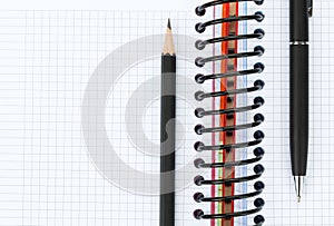 Blank notepad with pen and pencil