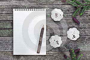 Blank Notepad with pencil, Christmas cookies and spruce branches