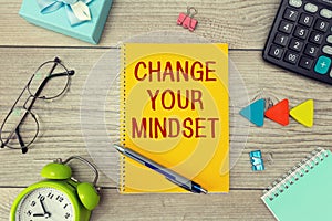 Blank notepad with text CHANGE YOUR MINDSET