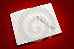 Blank open notebook on white background, included clipping path. Red notepad with pencil