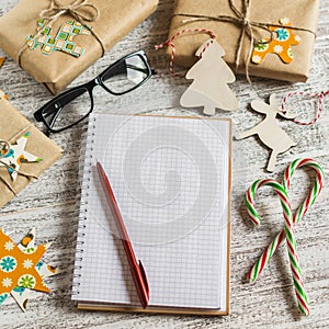 Blank open Notepad, Christmas gifts, candies