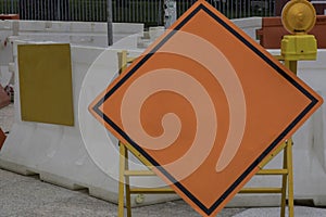 Blank orange diamond-shaped construction warming sign