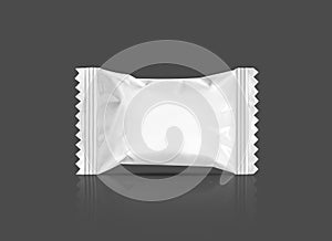 Blank packaging candy palstic sachet isolated on gray photo