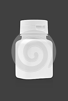 Blank packaging medicine plastic bottle isolated on gray