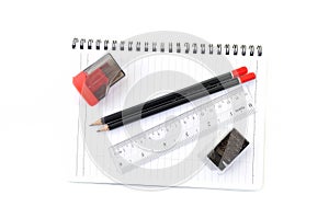 Blank page with pencils, eraser, ruler and sharpener